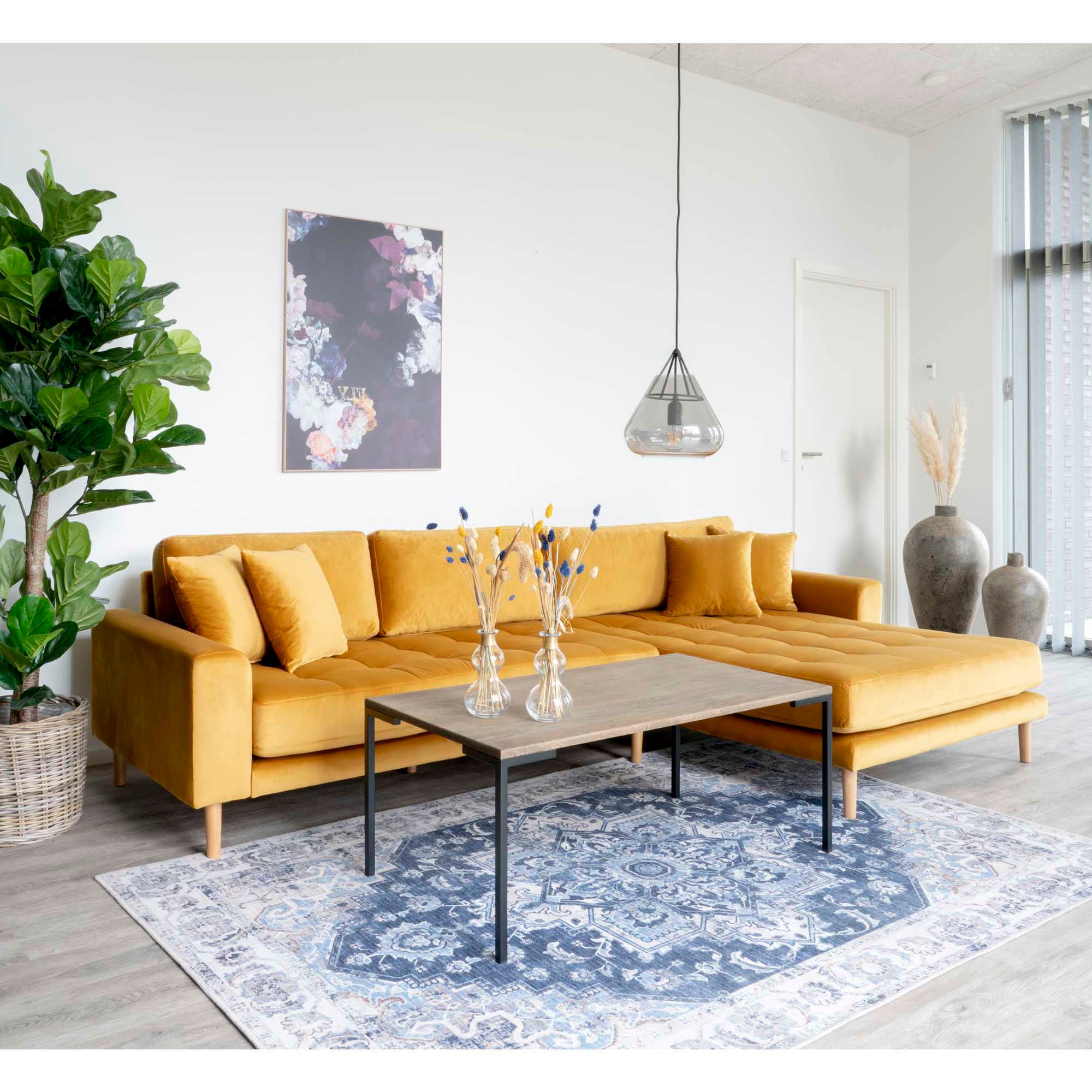 right-facing in mustard yellow velor with four cushions and natural wooden legs
